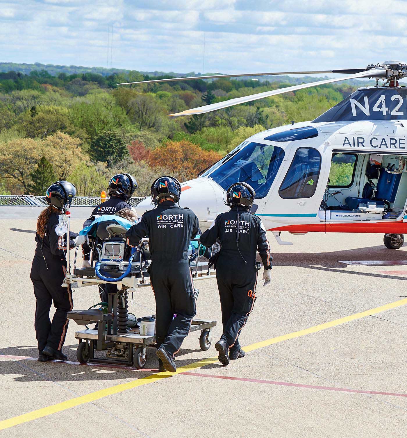 North Memorial Health Air Care team transporting a patient to a helicopter