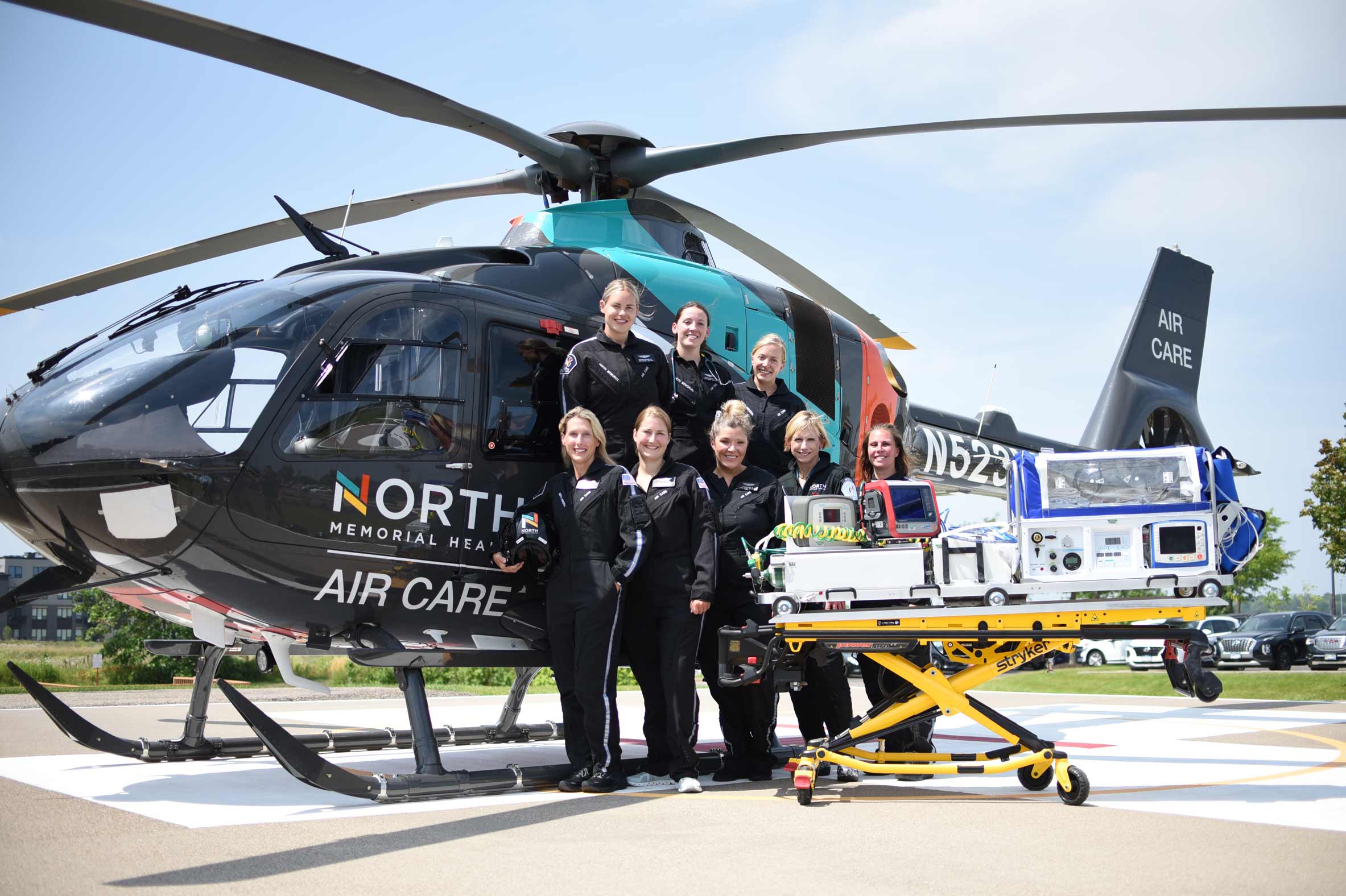 North Memorial Health Air Care team with new helicopter and NICU isolette